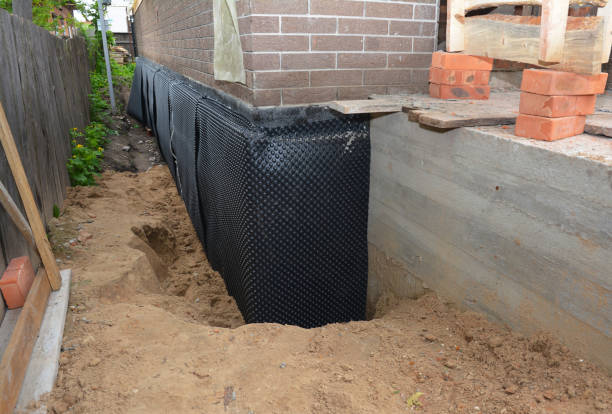 SJ Waterproofing Pros technician performing targeted Exterior Waterproofing assessment in Bloomfield, NJ